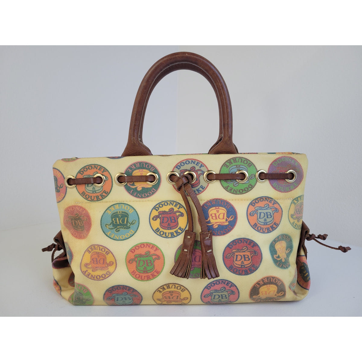 Vintage Y2K Dooney & Bourke Medallion Coated Canvas Tassel Tote/Satchel