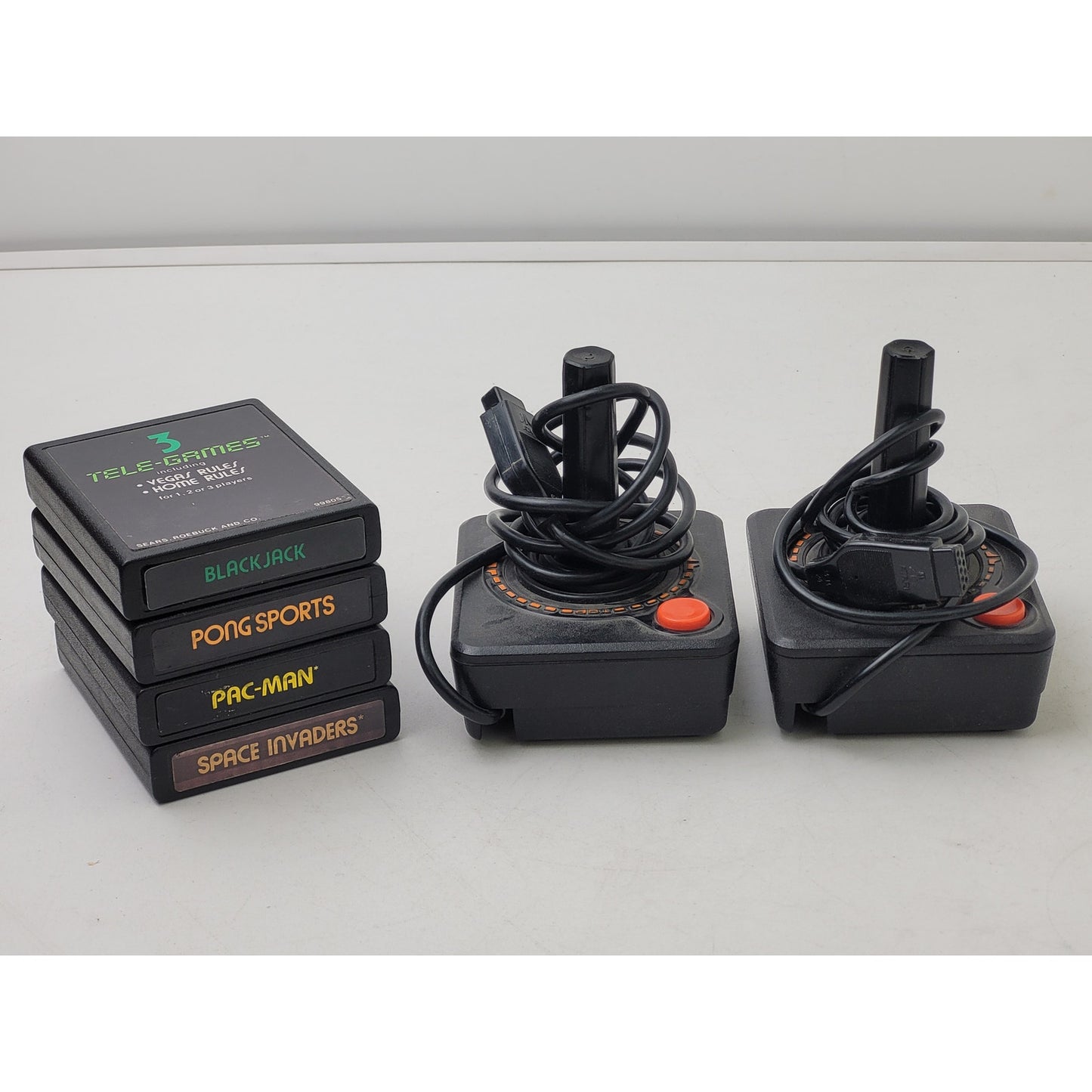 Vintage Atari 2600 Video Game Cartridges and Joystick Controllers