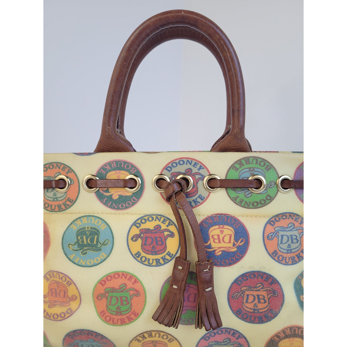 Vintage Y2K Dooney & Bourke Medallion Coated Canvas Tassel Tote/Satchel