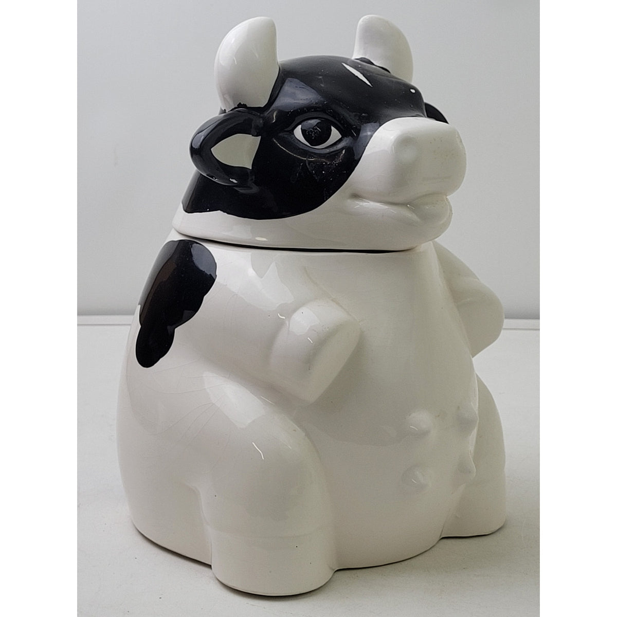 Vintage Ceramic Black & White Sitting Farm Cow Cookie Jar