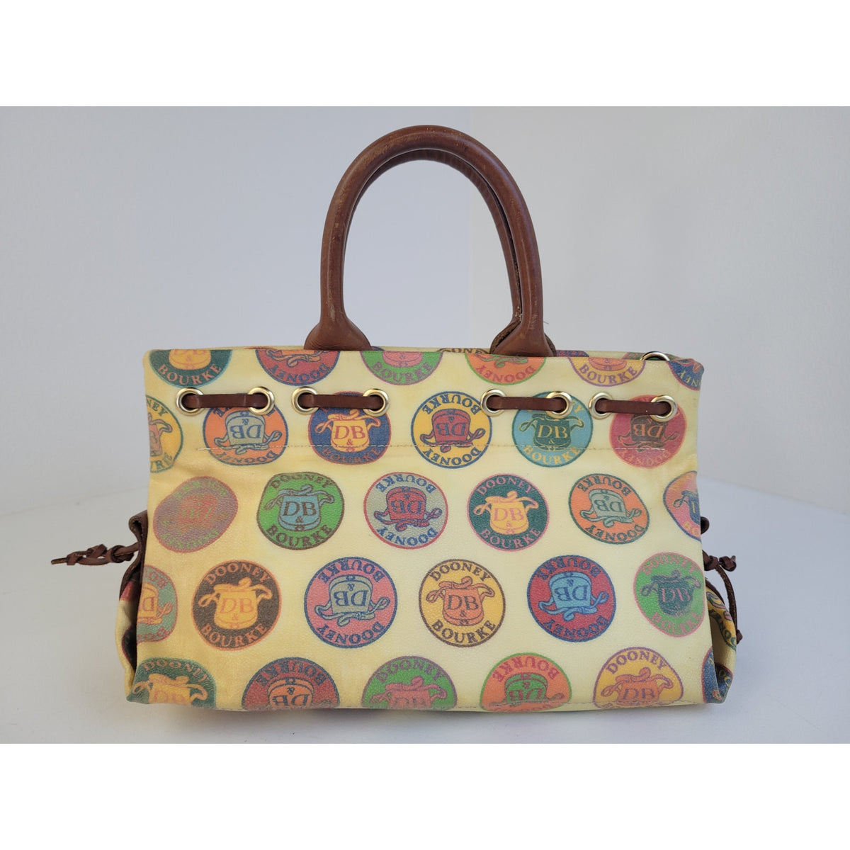 Vintage Y2K Dooney & Bourke Medallion Coated Canvas Tassel Tote/Satchel